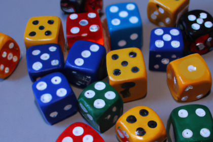 a photo of dices in happy colors on a table